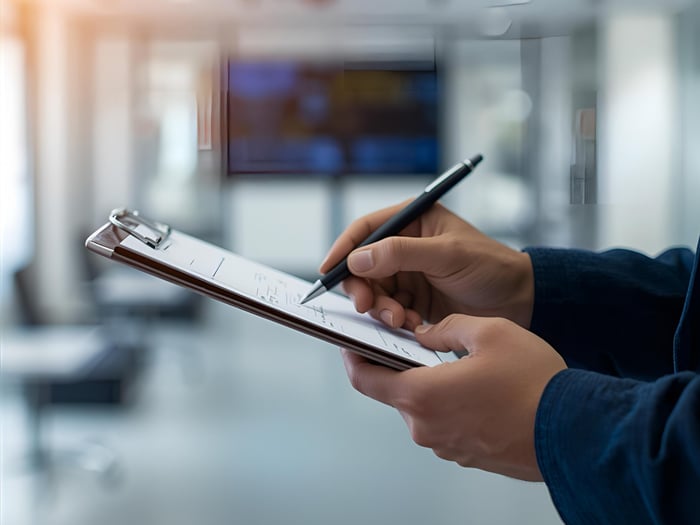 Facility assessment and remediation hand with clipboard2